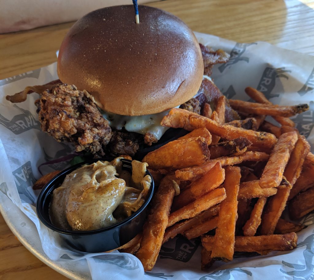 garlic hot chicken sandwich at the rail by fartley farms